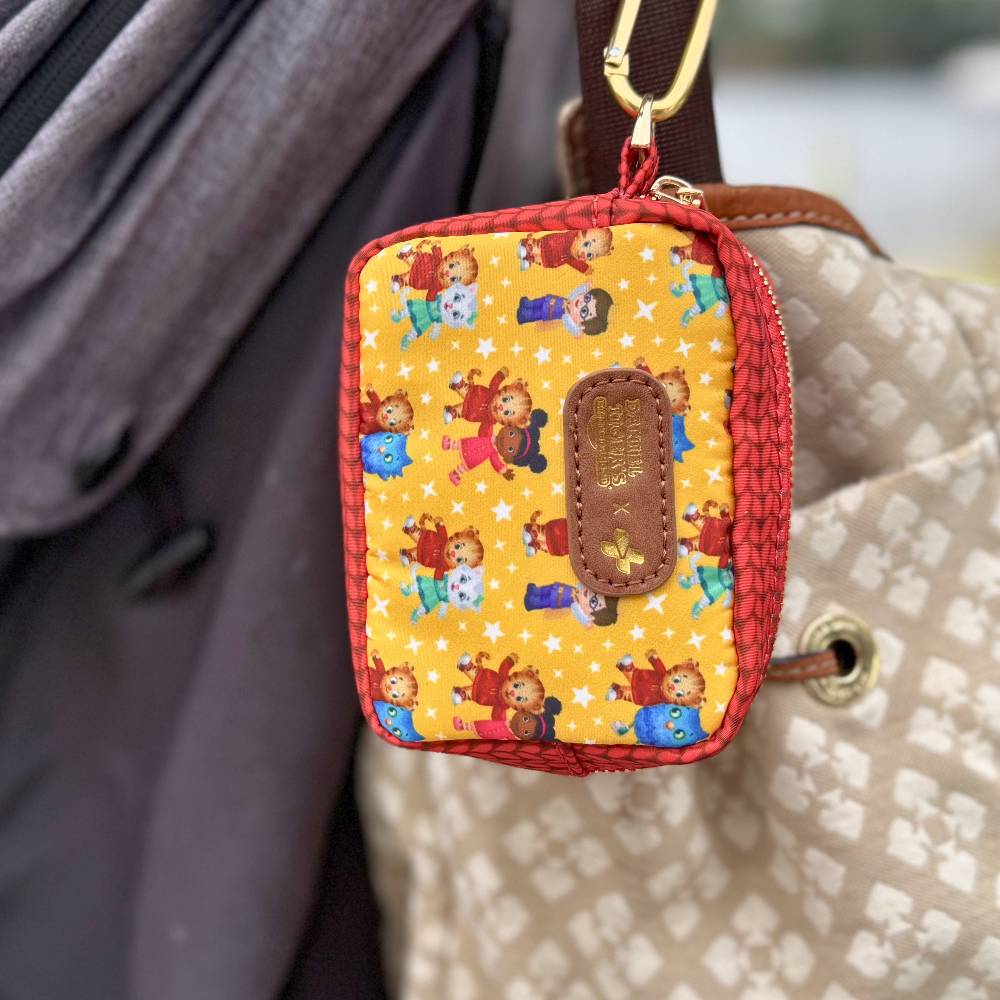 First Aid MiniKit with Daniel Tiger Design and clip hangs from diaper bag